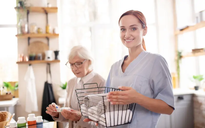 A woman holding a basket in front of another person.